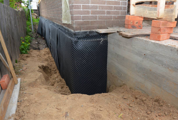 SJ Waterproofing Pros technician performing targeted Waterproofing assessment in Hohenwald, TN